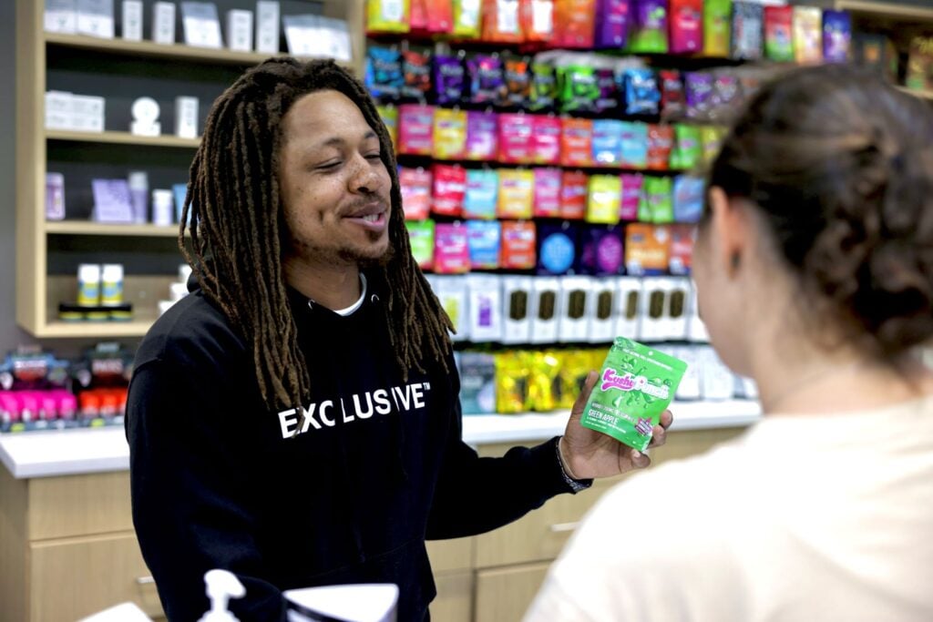 Employee explaining the one of their brand to the customer.